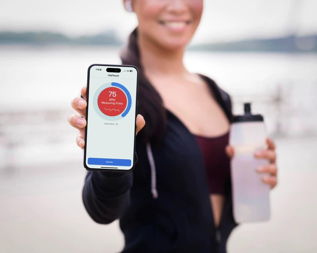 Woman measuring heart rate with Pulse AI
